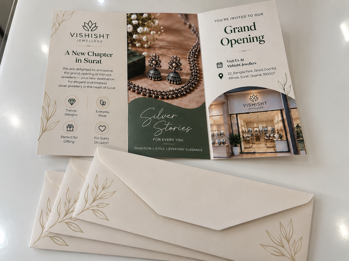 Vishisht Jewellers grand-opening tri-fold announcement with envelopes